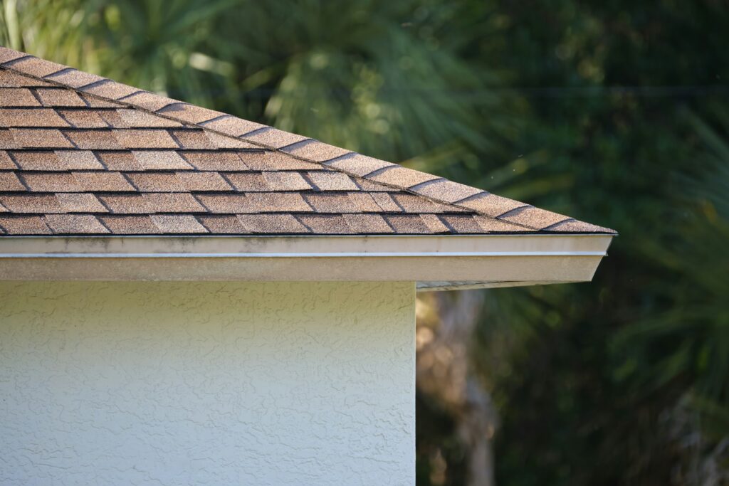 RM Roofing | closeup of house roof top covered with asphalt or bitumen shingles waterproofing of new building
