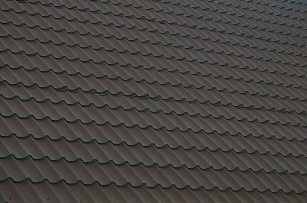 Roofing Solutions Brown metal roof tiles for roof installation, repair, and replacement – Wokingham roofing specialist.