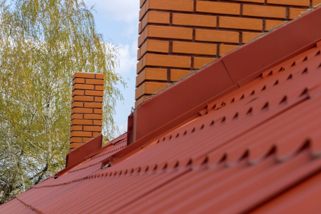 Red tile rooftop installed by roofing contractor RM Roofing in Wokingham – professional tile roofing solution.